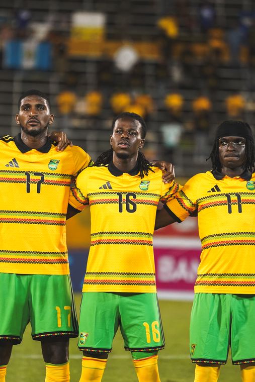 Numbers 17, 16 and 11 line up for the anthem
