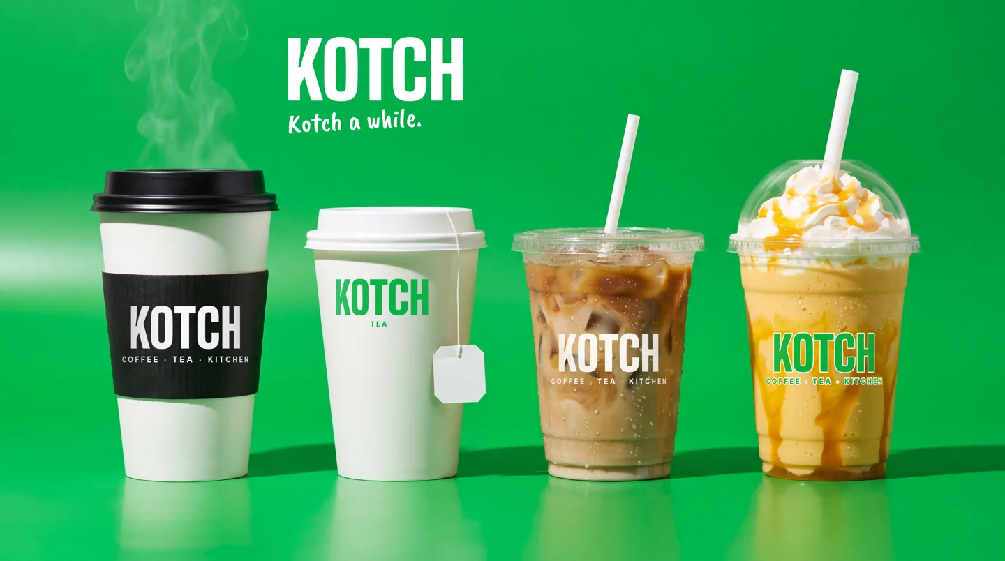 Four Kotch cups on a bright green set: a hot coffee cup with a black sleeve, a tea cup, an iced coffee and a mango frappé, each carrying KOTCH, under Kotch a while.