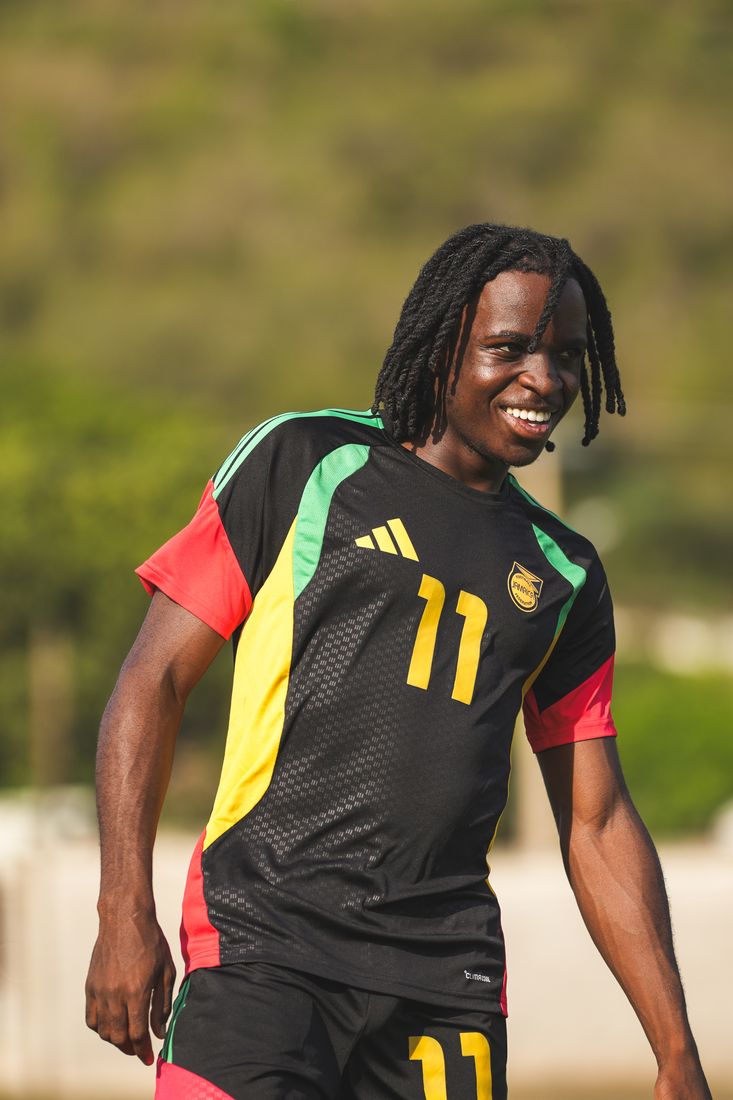 Number 11 smiles in the team training top