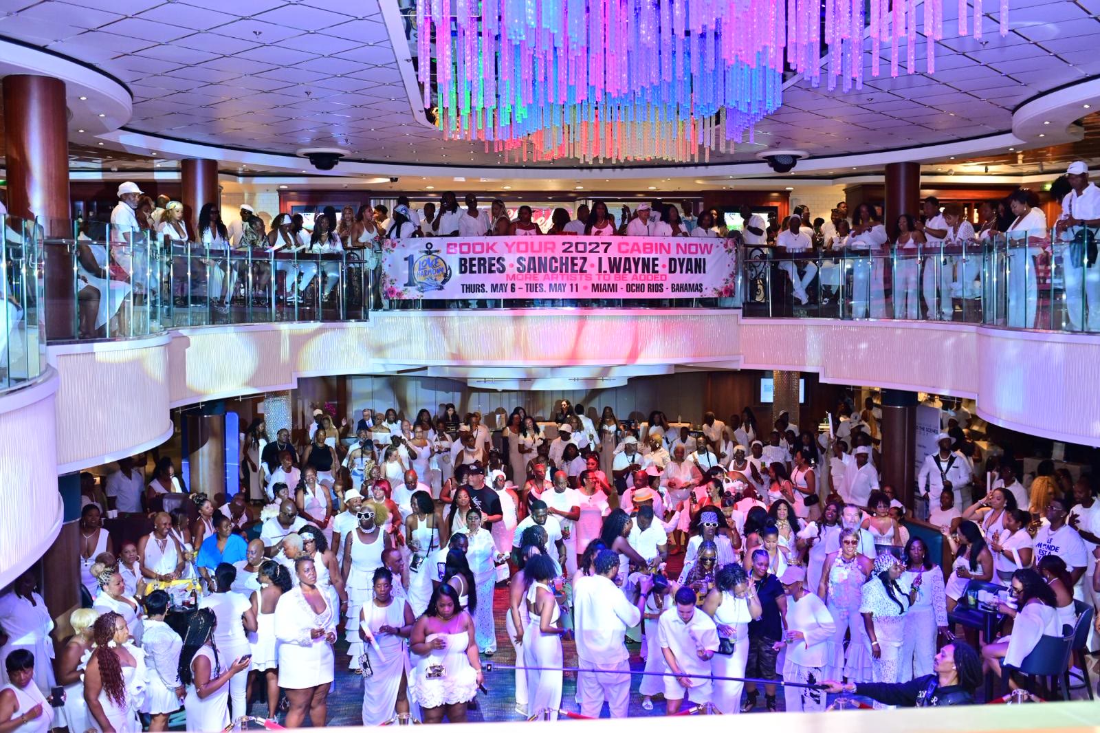 The atrium packed with guests dressed in white