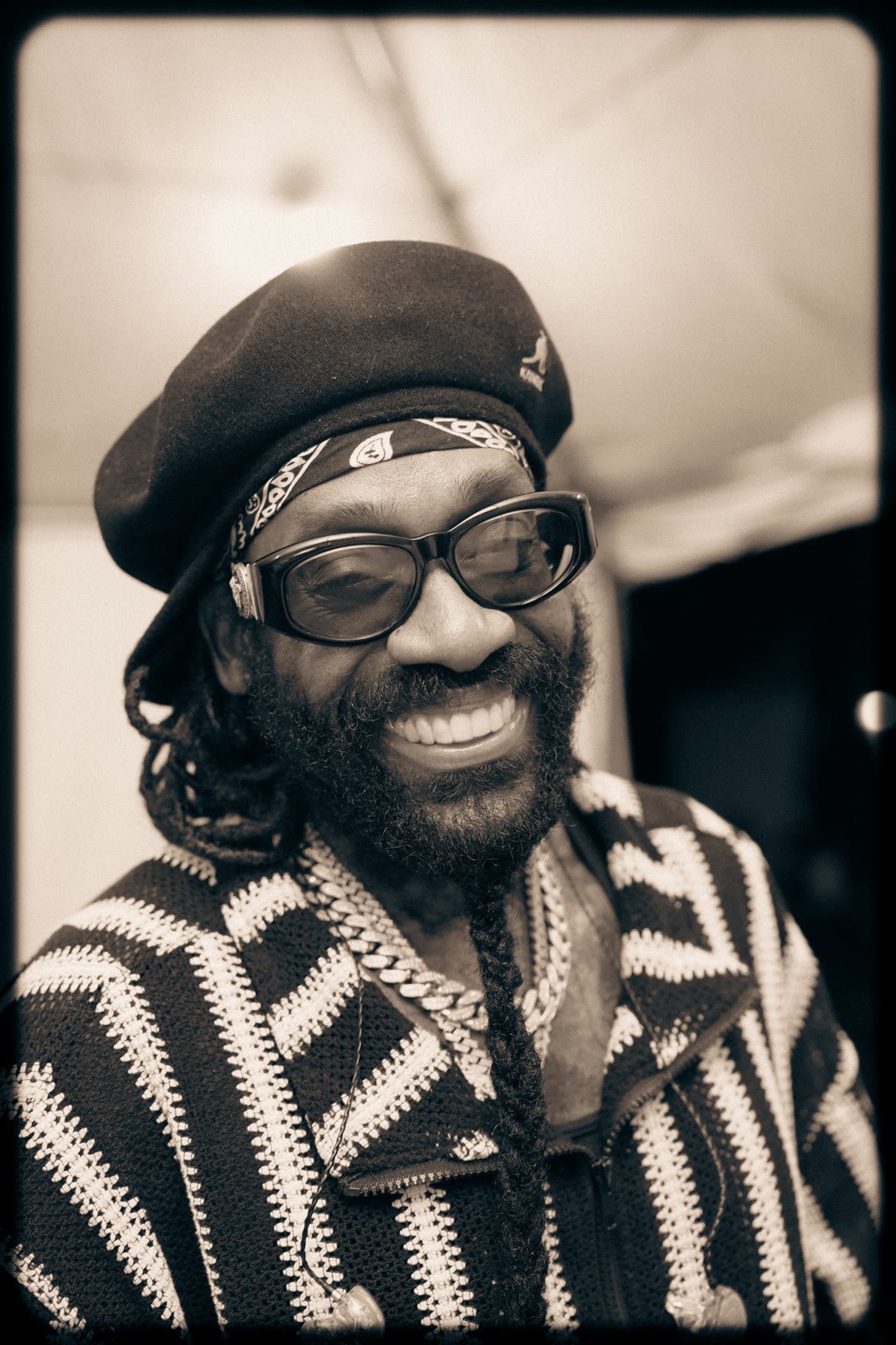 Tarrus Riley smiles backstage