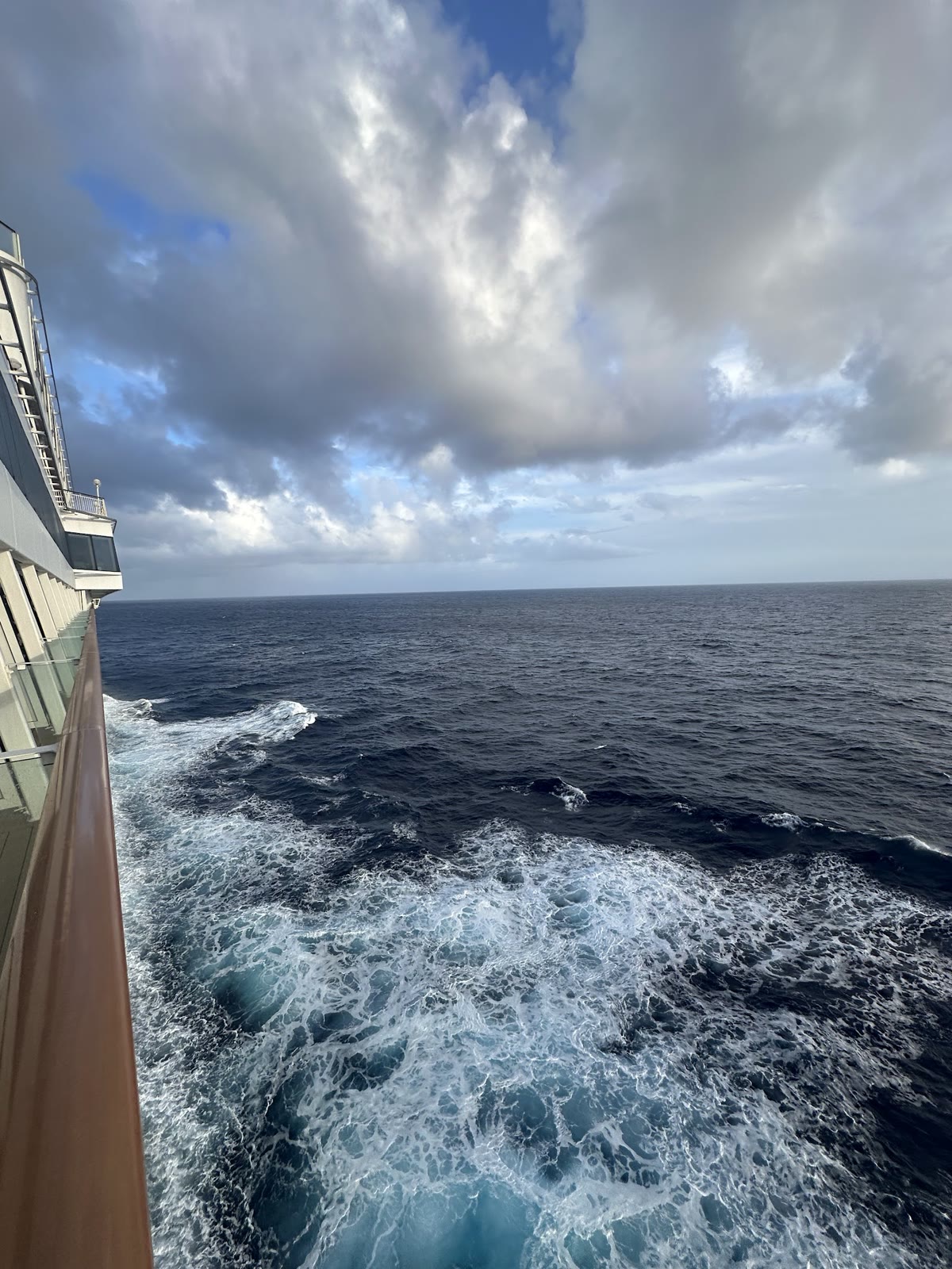 The ship's wake under a dramatic sky at sea