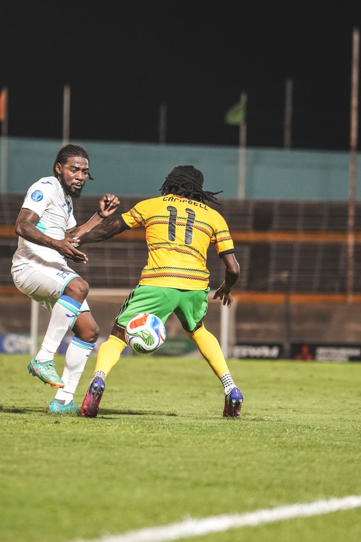 Number 11 takes on a Honduras defender