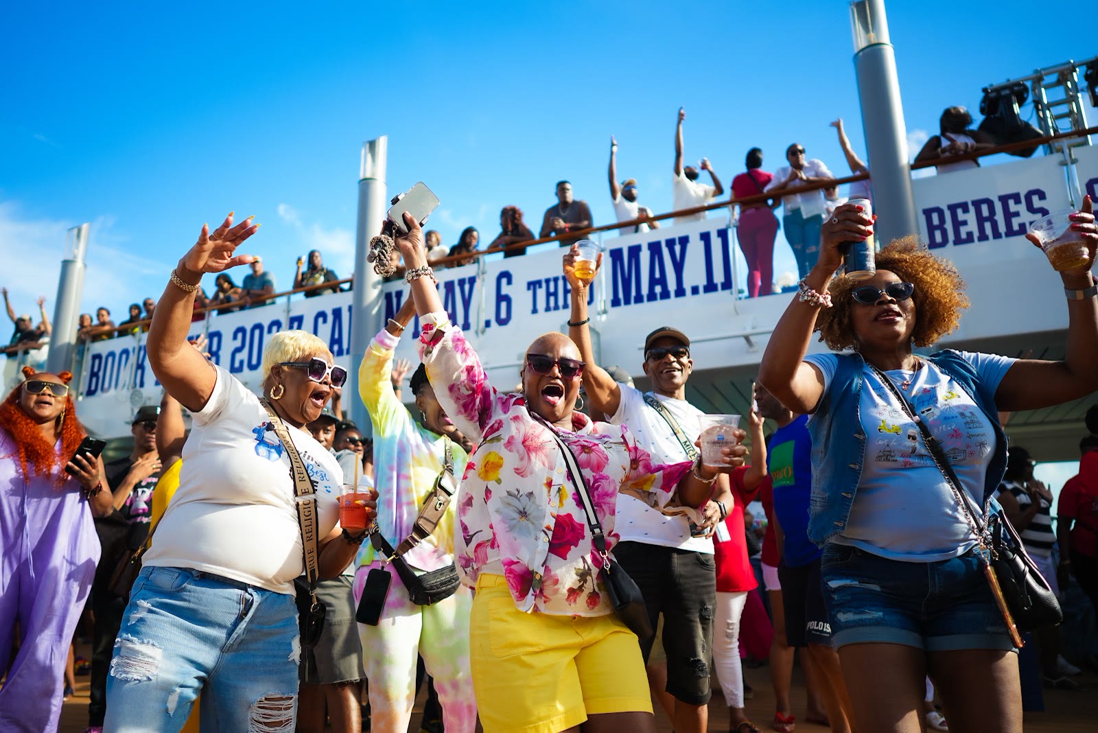 Guests celebrate along the ship's rail