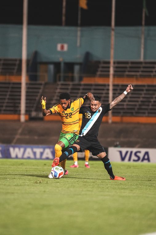 A Jamaica player strikes the ball in the first half