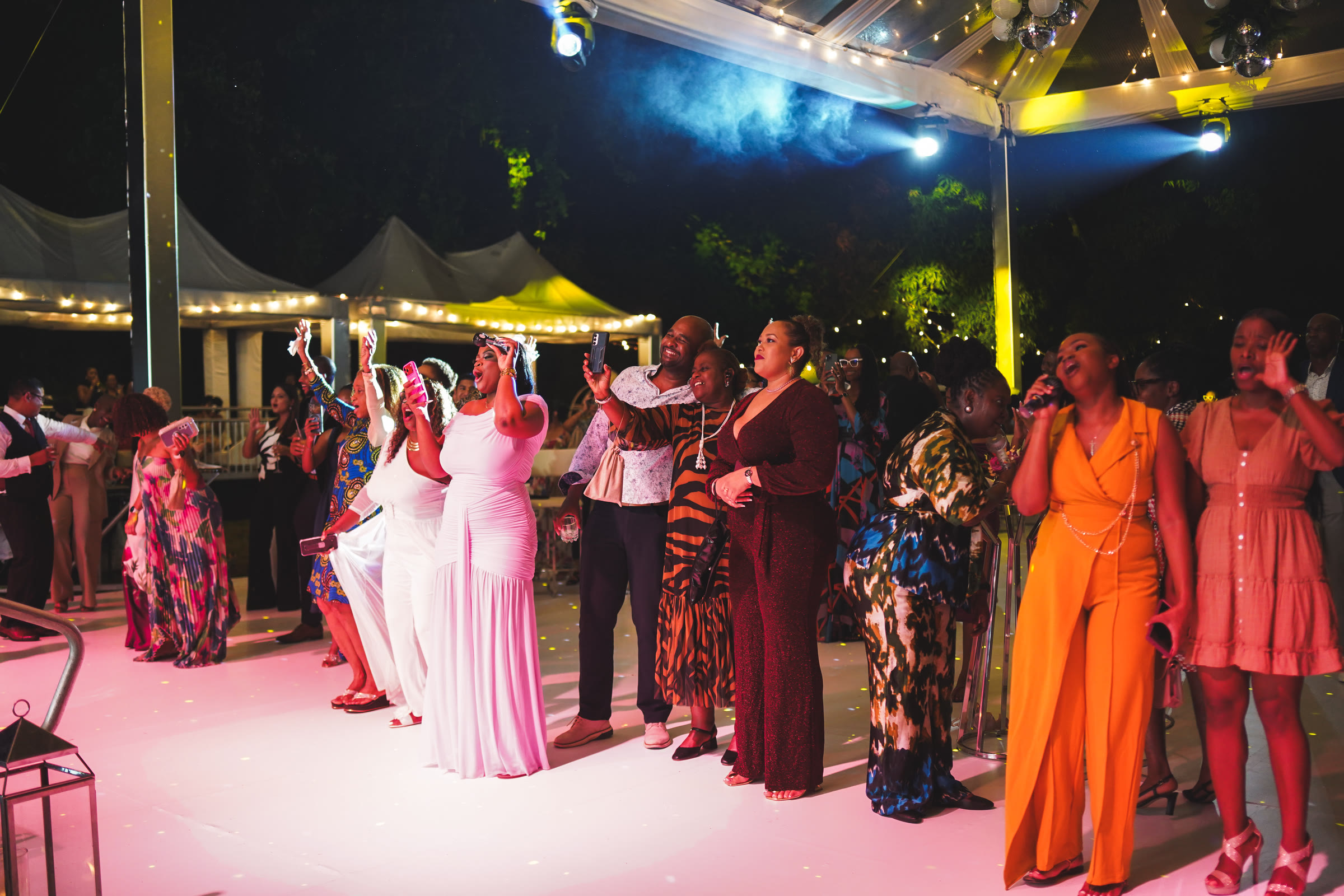 Guests dance and take selfies on the dance floor