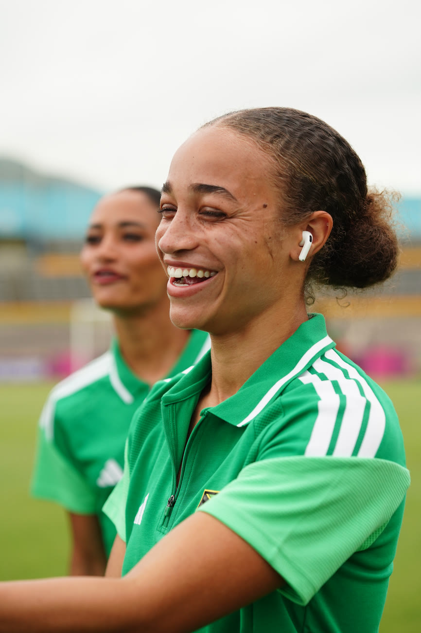 A player laughs during the pitch walk at the National Stadium
