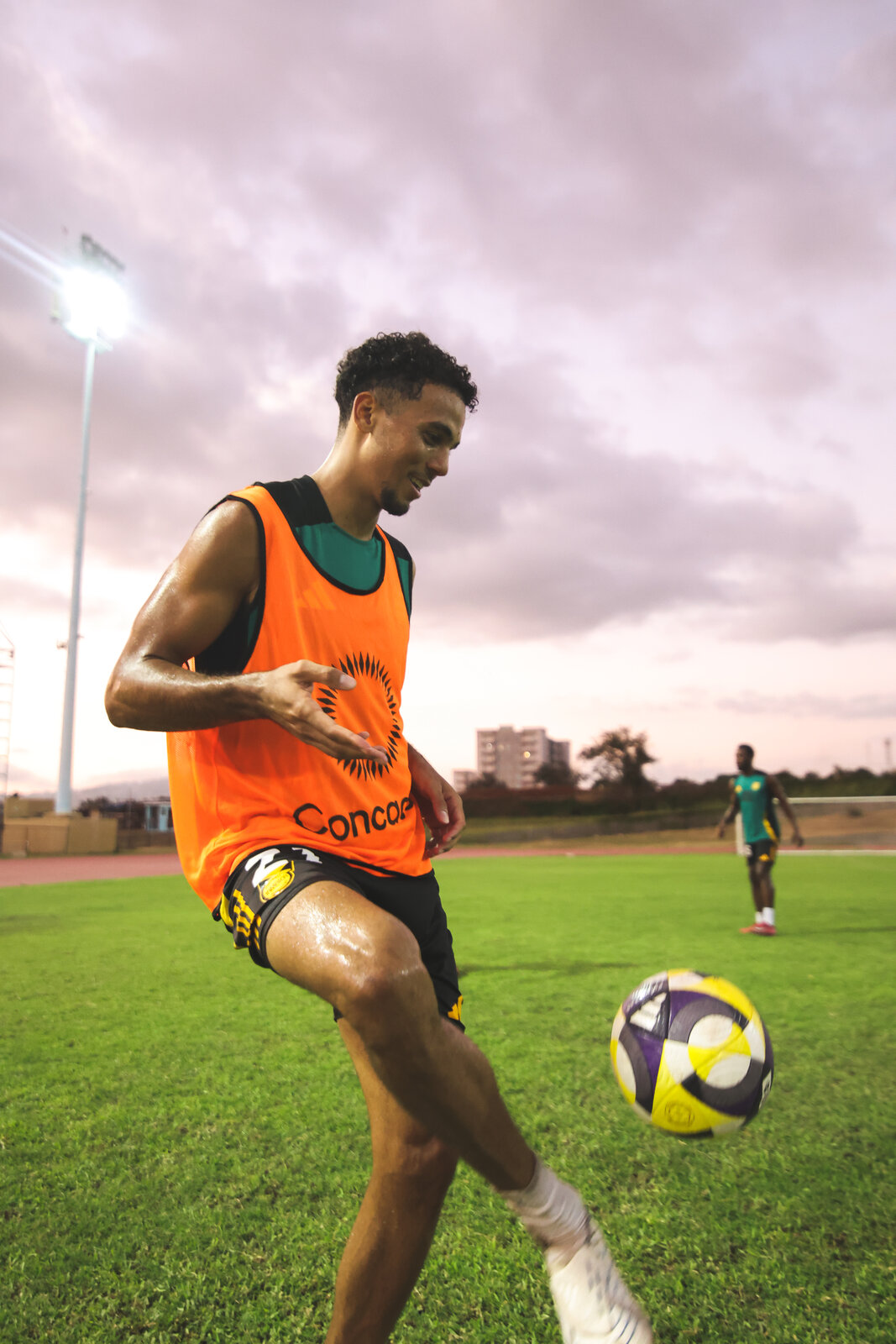 A Reggae Boyz player works the ball in training camp