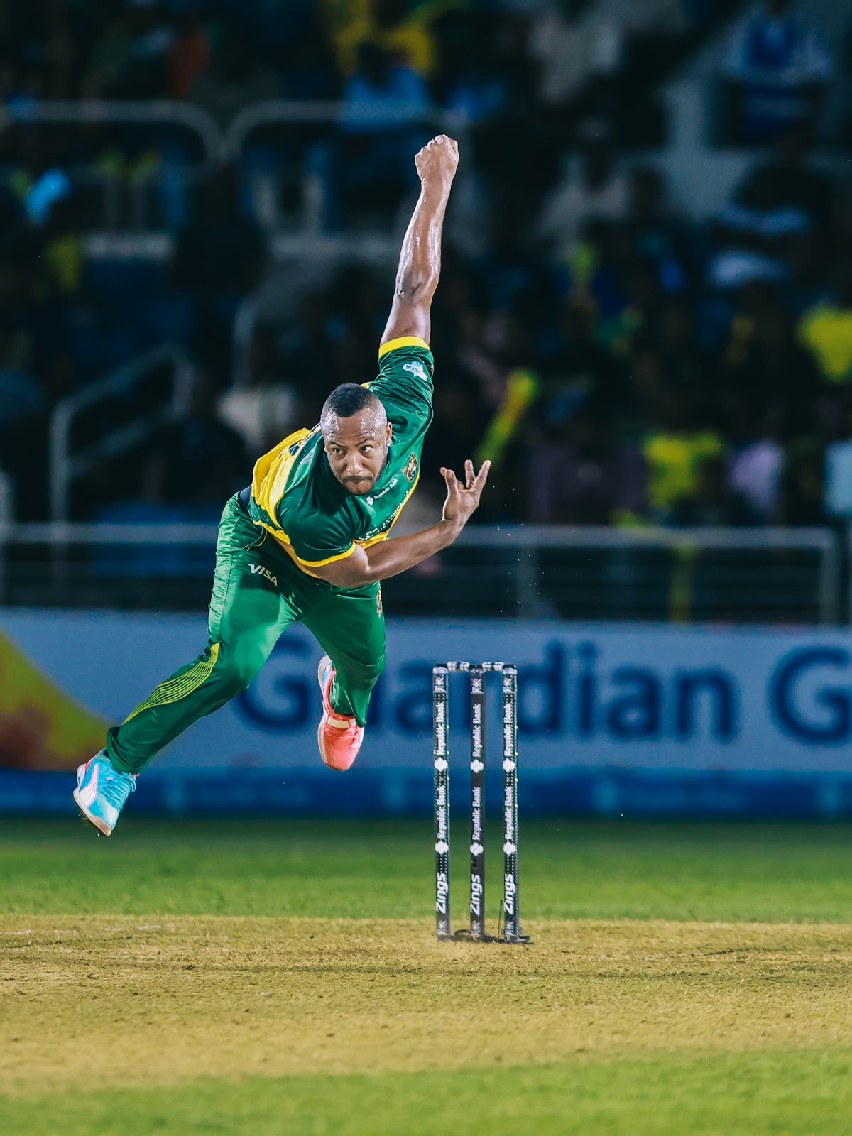 A Kingsmen bowler in his delivery stride