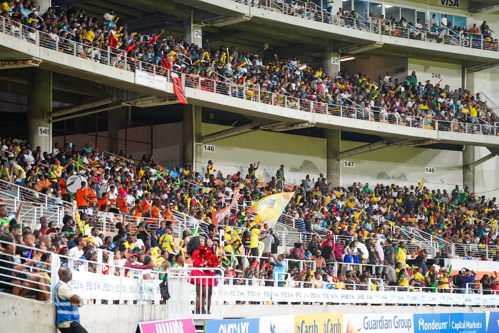 Supporters in Kingsmen yellow and green fill the Sabina Park stands