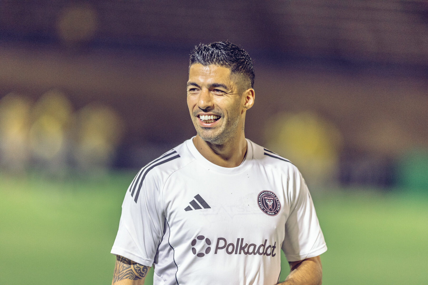Luis Suarez smiling in the white Inter Miami away kit