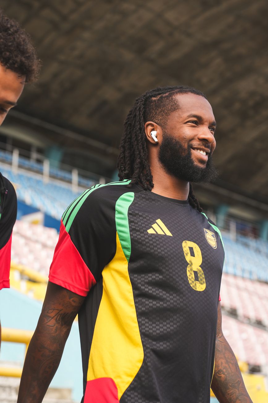 A smiling Reggae Boyz player in training kit