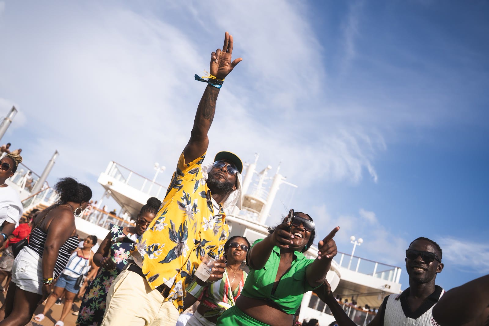 Guests dance at an afternoon deck party