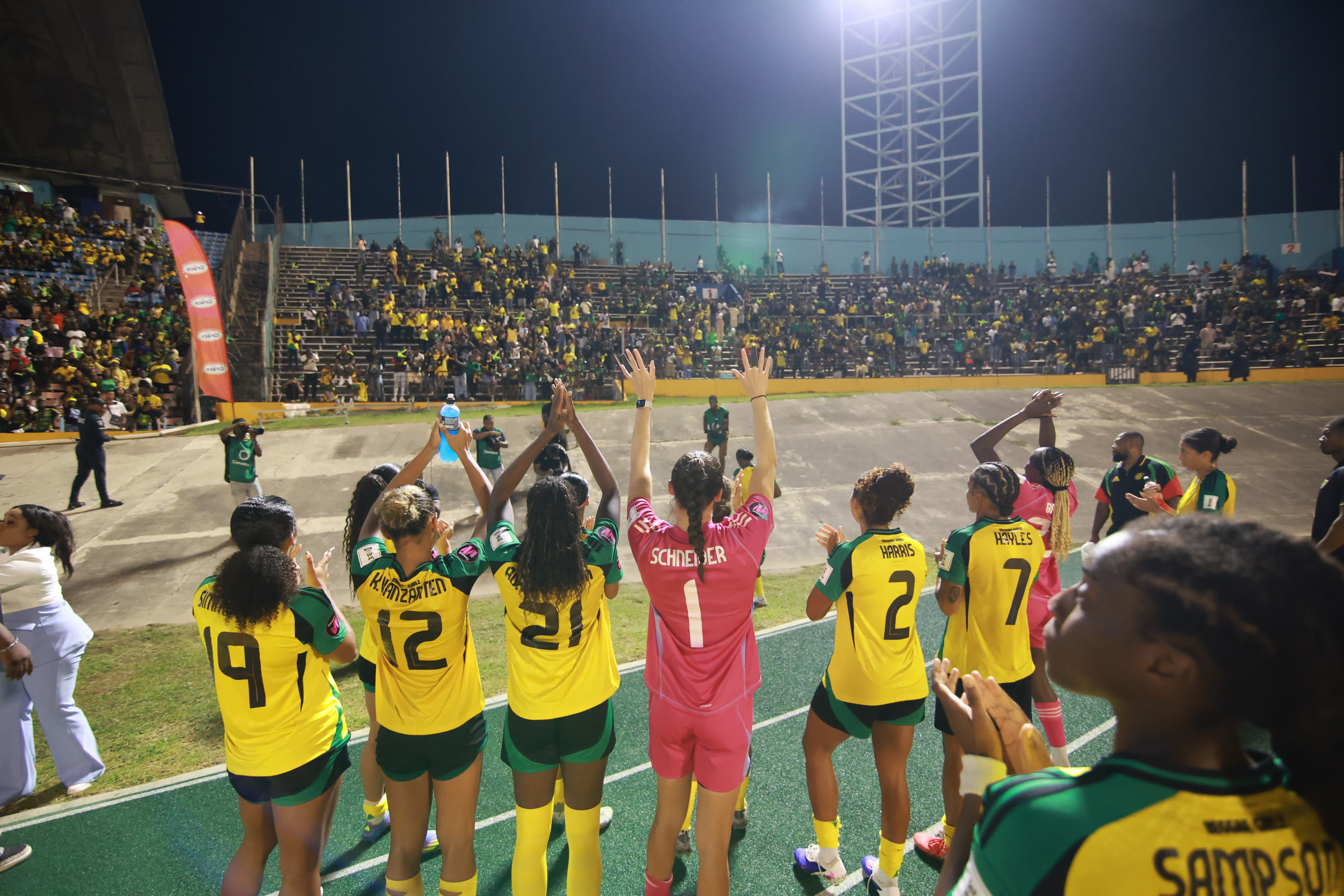 The Reggae Girlz salute the fans at the National Stadium on the night they qualified