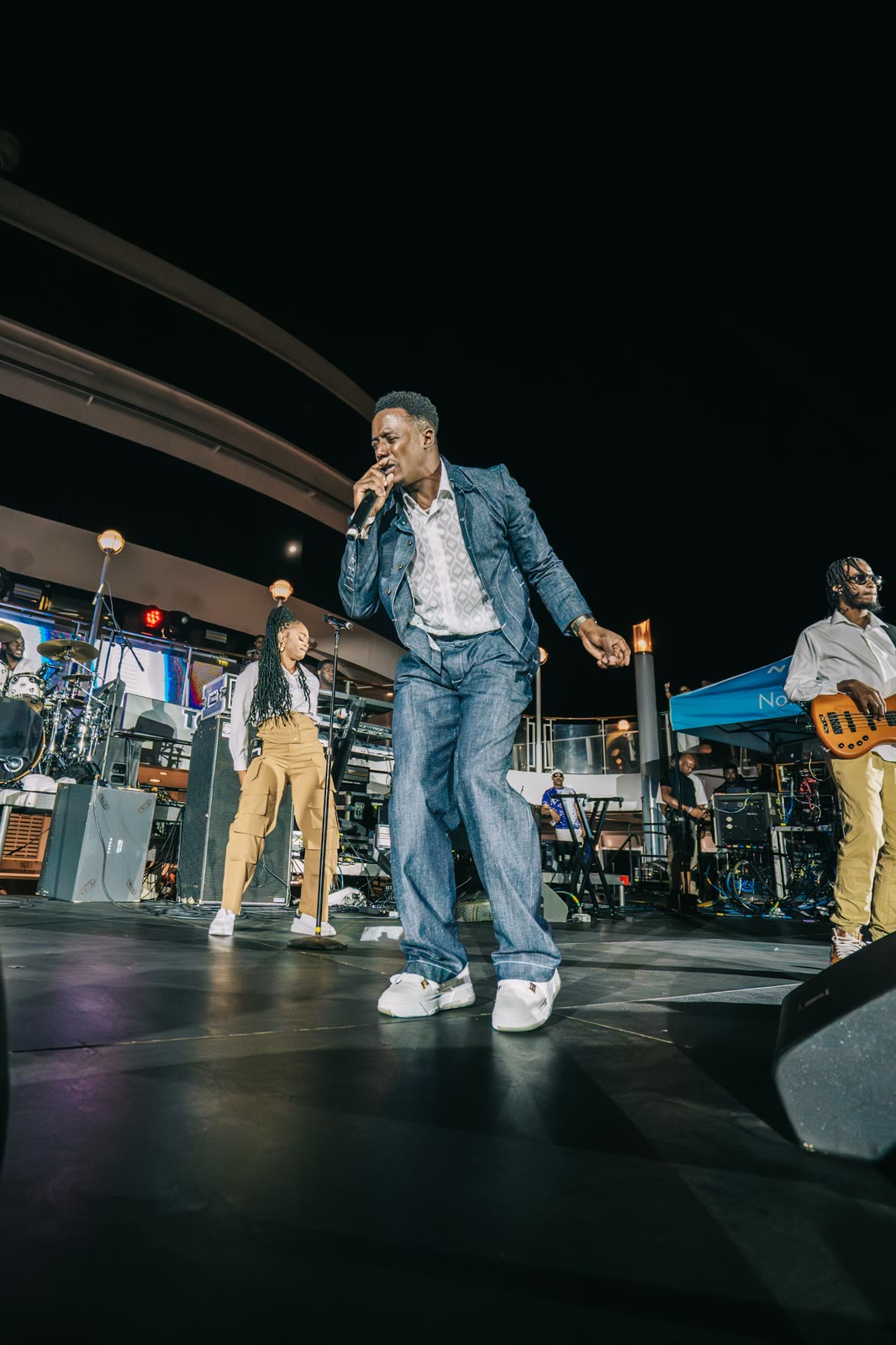 A headline artist performs on the night stage