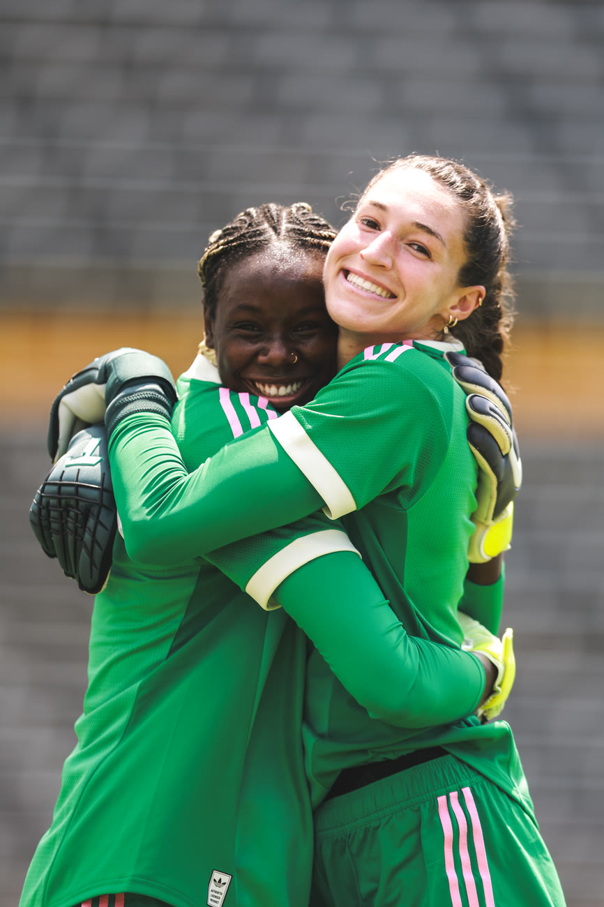 The goalkeepers embrace at training