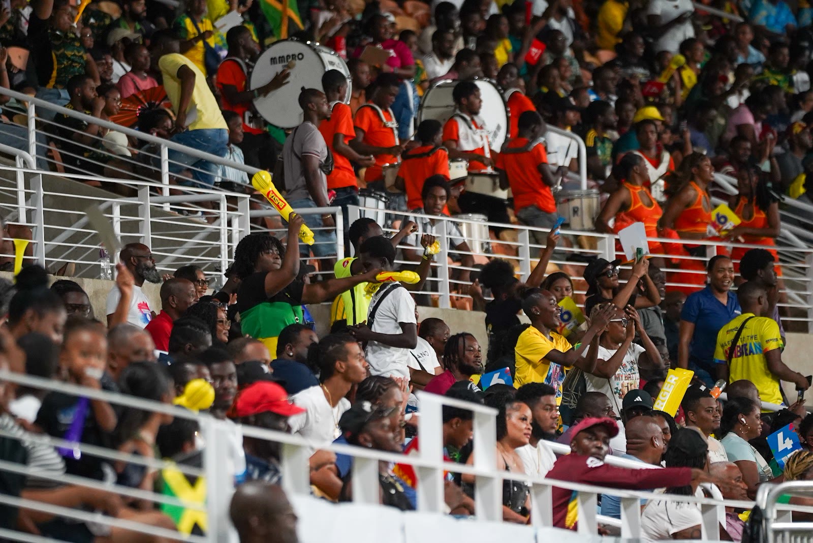 A packed section of supporters celebrating at Sabina Park