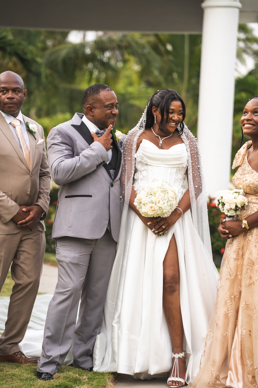 The bride and groom stand together at the front of the ceremony