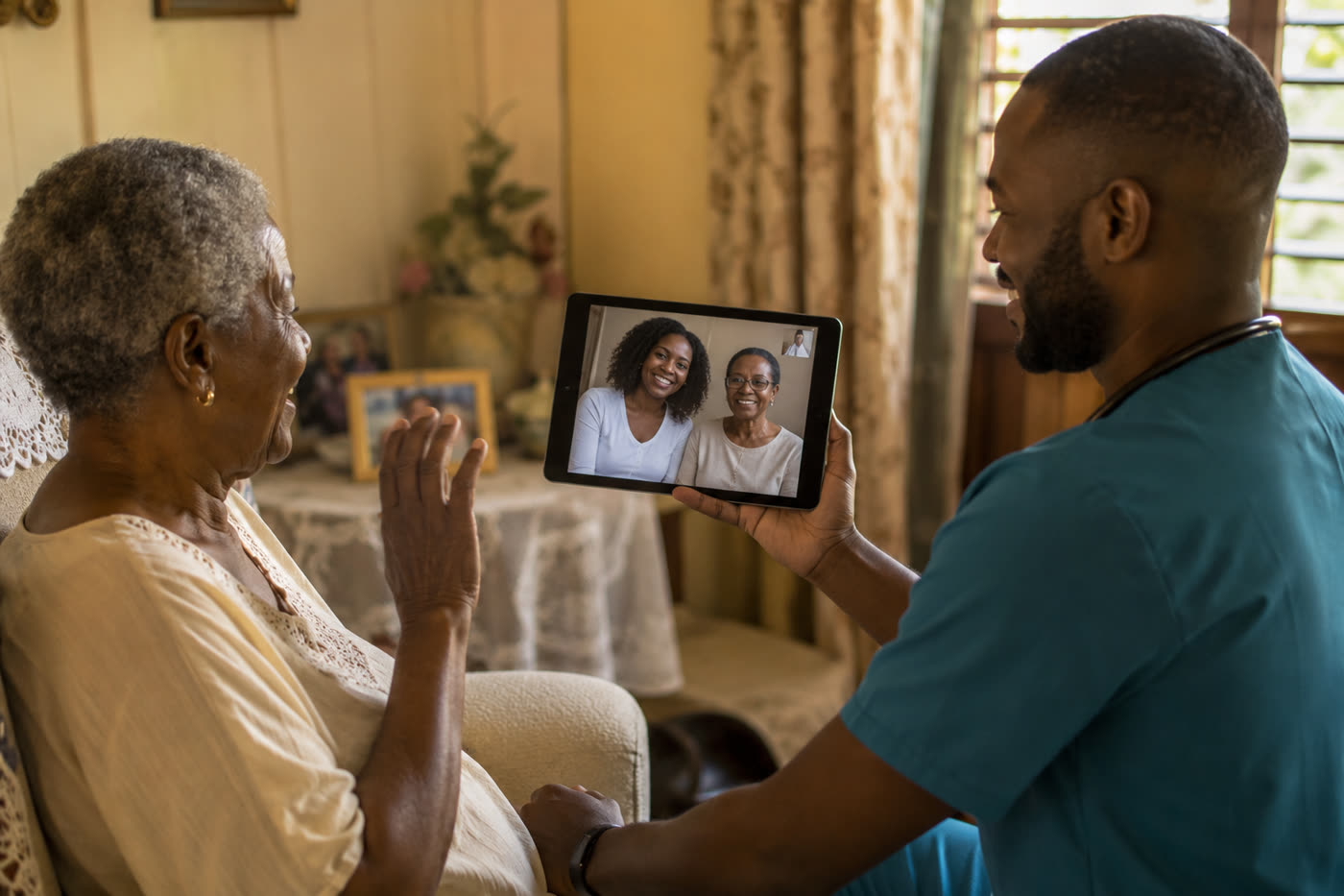 A Douvan Health clinician holding a tablet so a patient at home can see her family on a video call