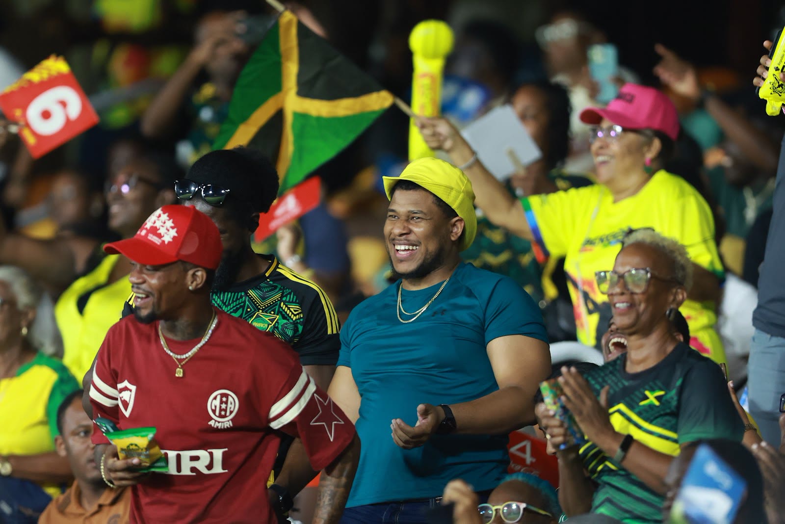 Supporters laugh and celebrate together in the stands