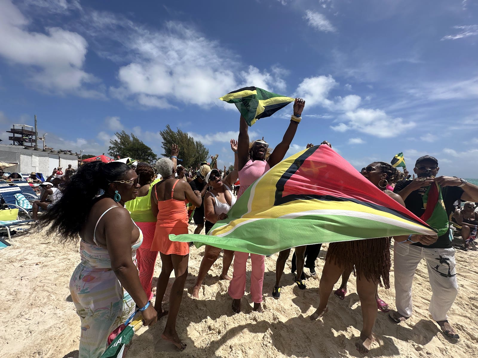 Flags fly over guests on the beach