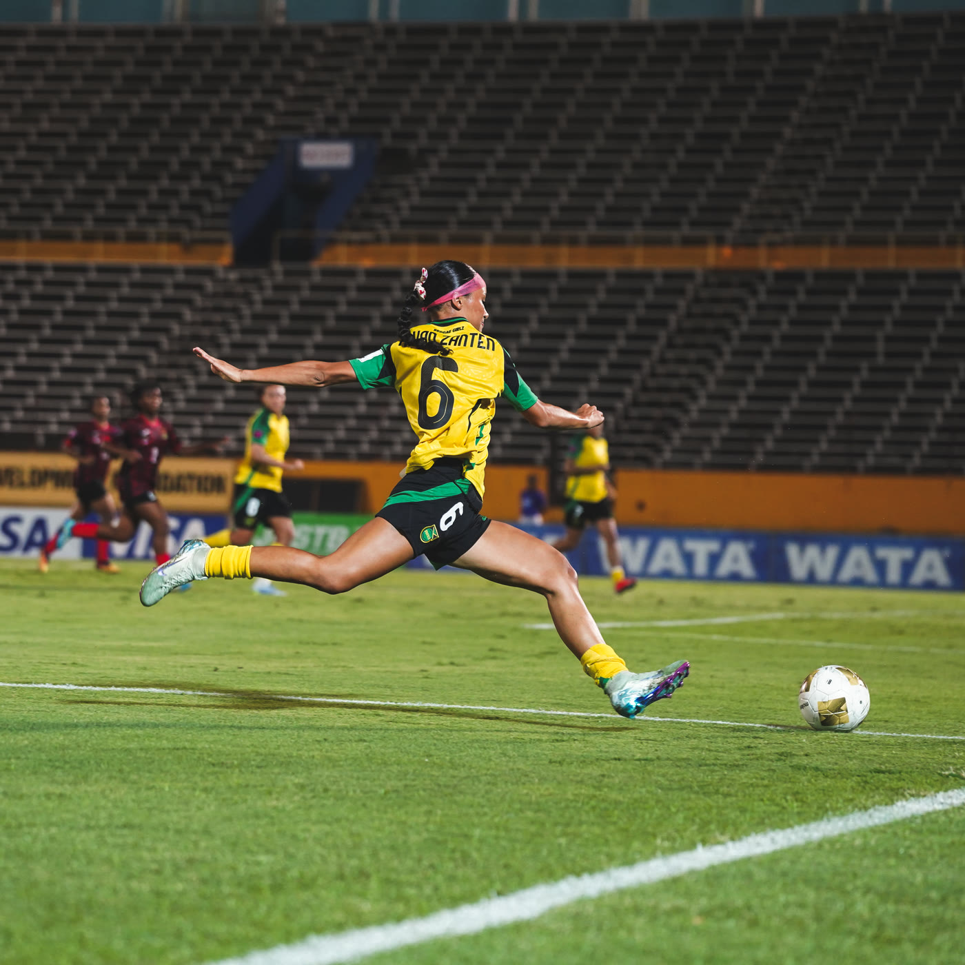 Number 6 strikes the ball against Antigua & Barbuda