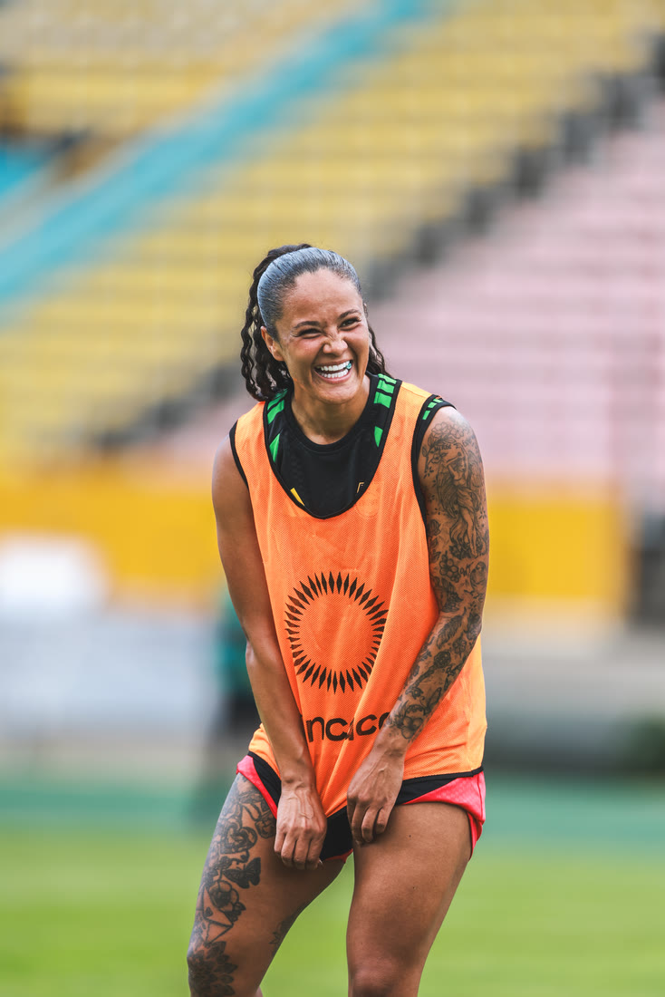 A player laughs in a training bib