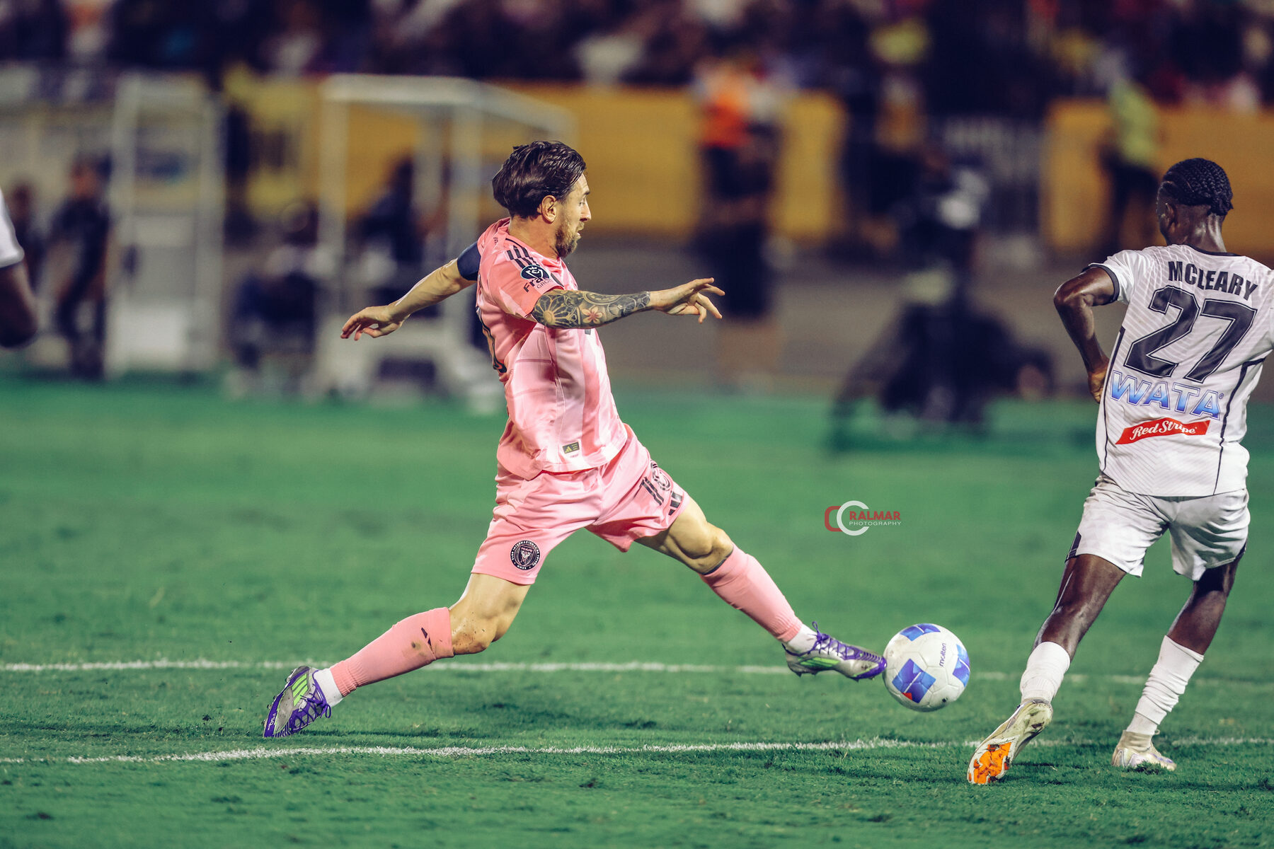 Lionel Messi on the ball in the pink Inter Miami kit