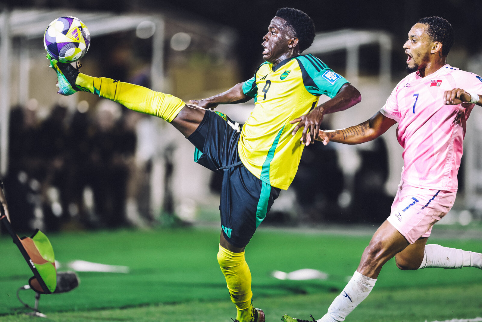 Whisper Richards controls the ball boot-high in the Jamaica number nine kit